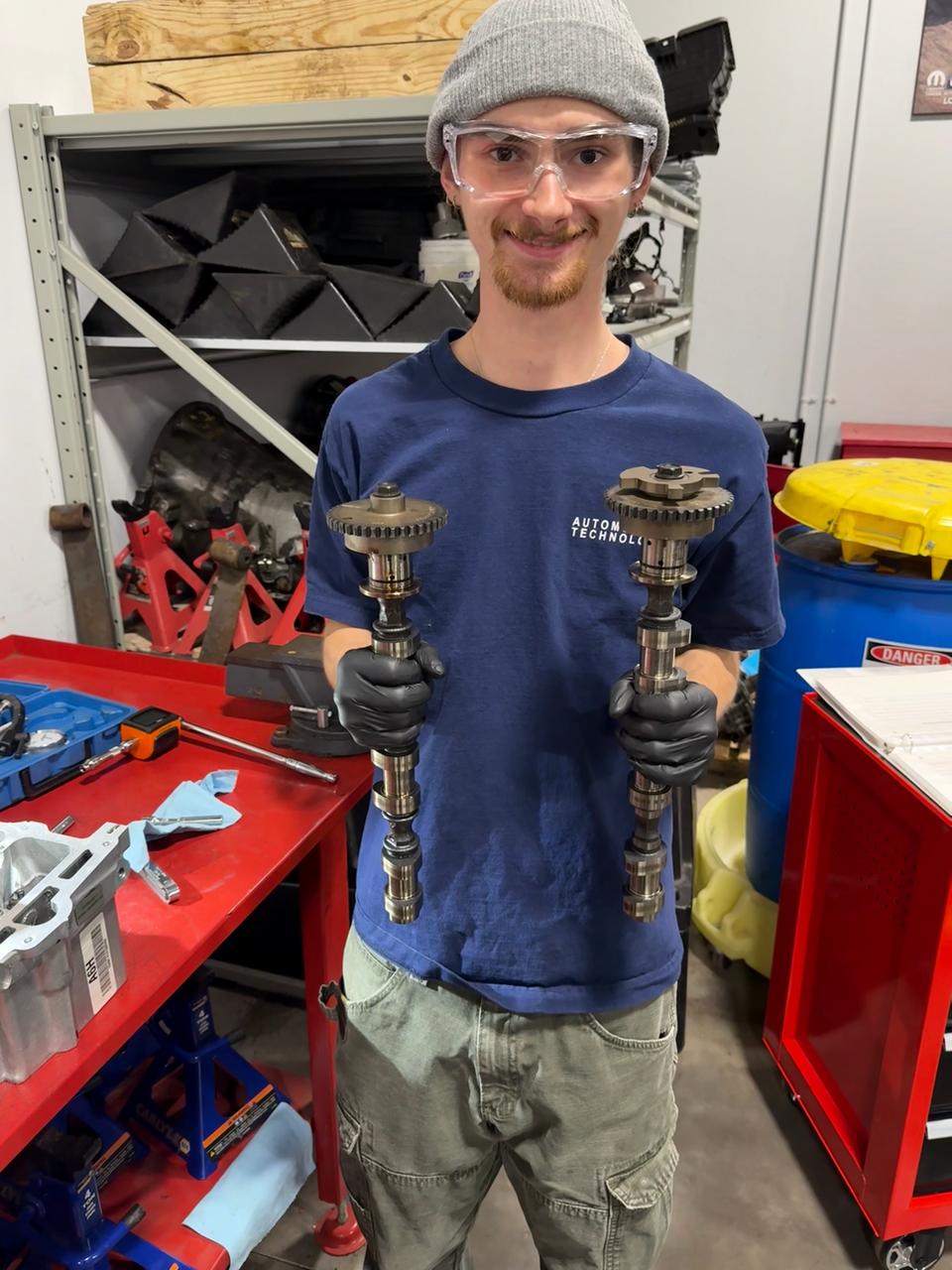 Aydan holding camshafts at RVCC